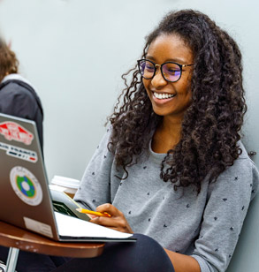 A female student works on a laptop