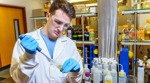 Young man does research in a lab at Rose-Hulman.
