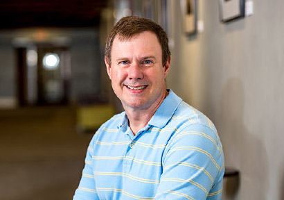 Dr. Daniel Morris in a laboratory setting.