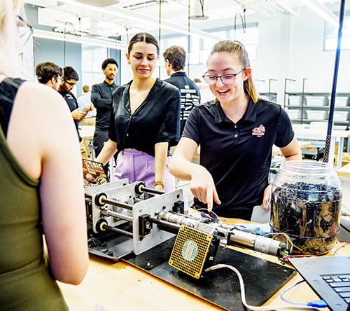 !Female students working on project