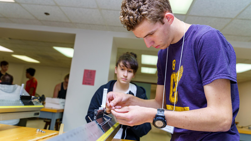 A male student and female student work together in classroom.