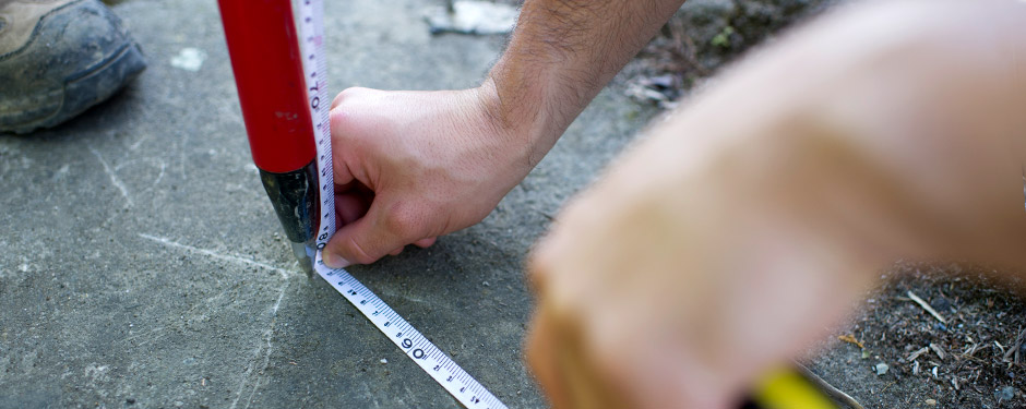 Female student working on an outdoor civil engineering project.