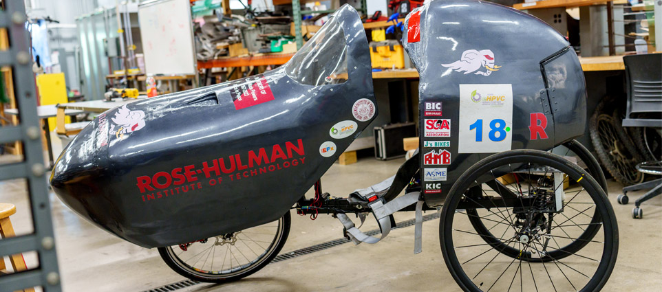 A recumbent bike encased in an aerodynamic shell.