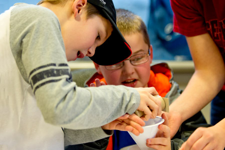 oung students use recycled cardboard tube during Explore Engineering project.