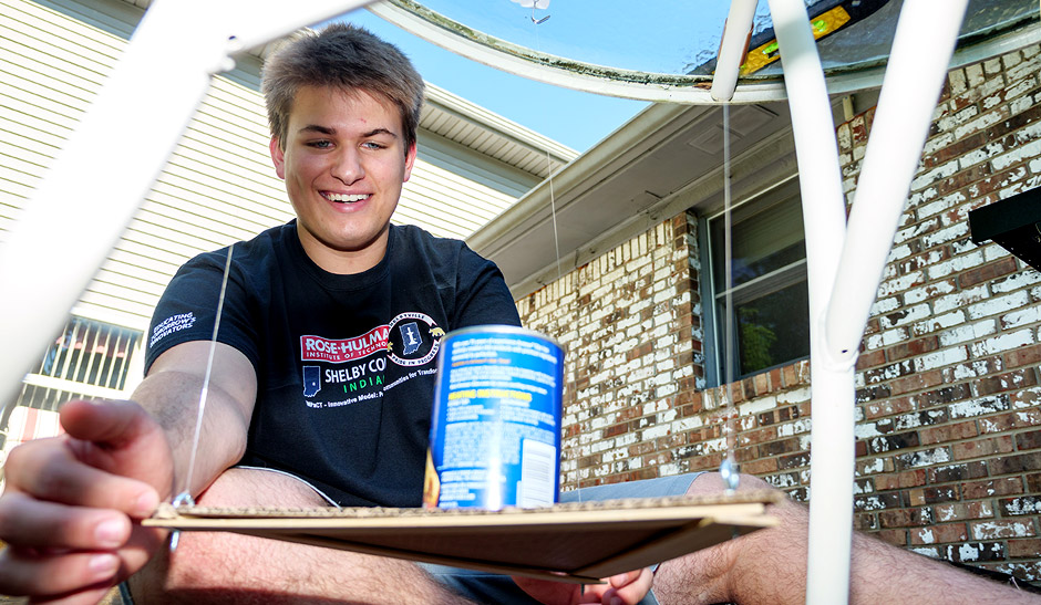 Austin Perry works on a Creation Crates project.