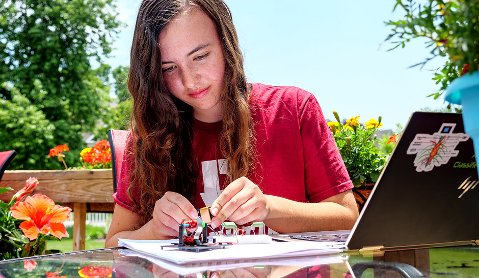 Katie Collins works on a Creation Crates project.