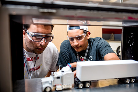 Two Catapult students working on a wind tunnel project at Operation Catapult.