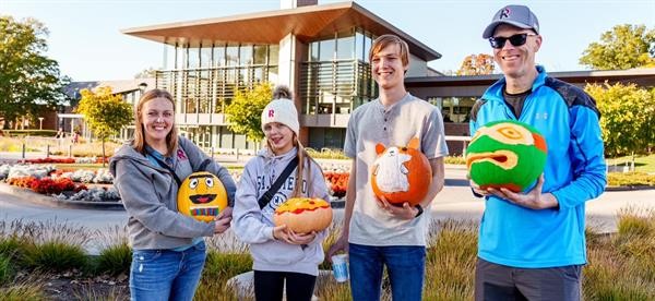 Fall family weekend students with pumpkins