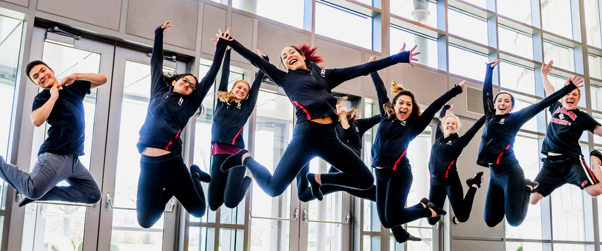 Rose-Hulman’s dance leaping in the air and smiling inside Hatfield Hall.