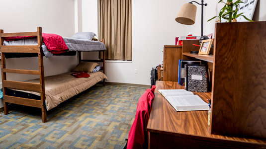 Bunk beds and desks in a Lakeside bedroom