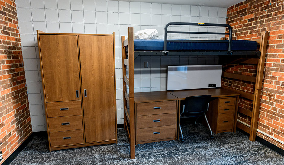 Bunk beds and desk in a room in one of the triplets.