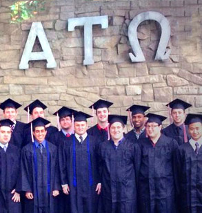 Graduating members ofAlpha Tau Omega pose outside of their fraternity house