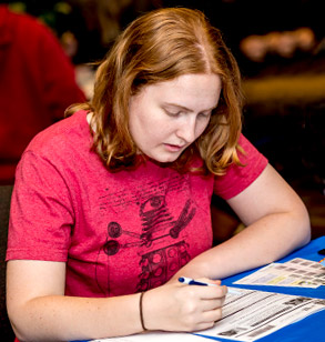 Female student filling out forms.