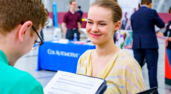 !Senior design team members explain project at Career Fair.