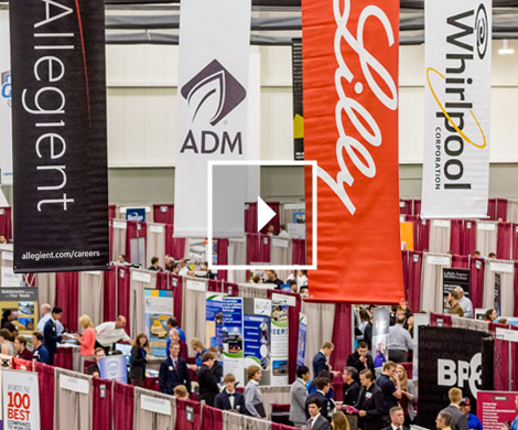 Overview of the career fair showing many students meeting with recruiters