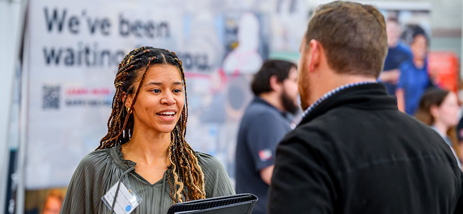 Student speaks with recruiter at Rose-Hulman's career fair.