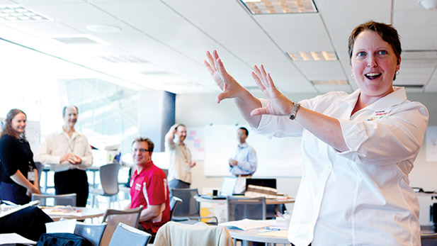 Professor Ella Ingram gestures in a classroom.