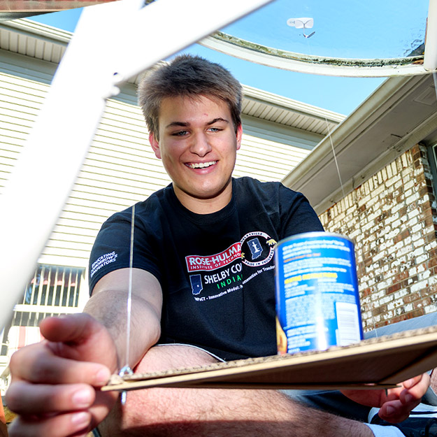 The image shows three different students working at their homes on Creation Crates projects.