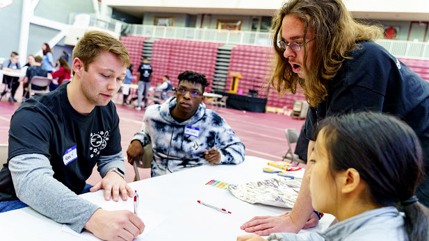 Rose student helping SPARK participants