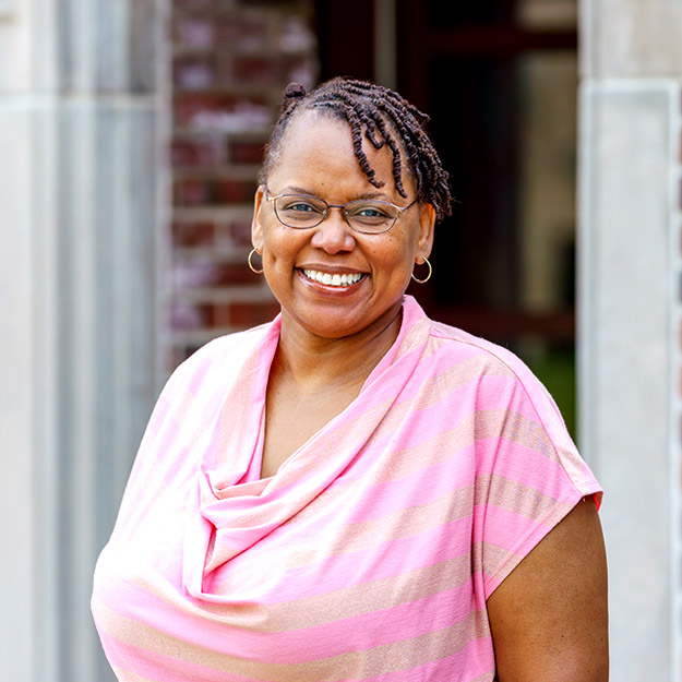 Carlotta Berry stands outside.