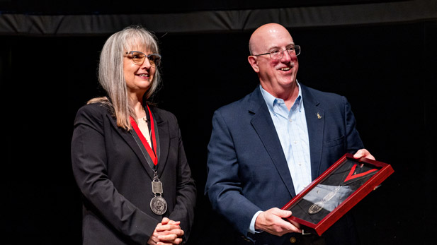 Sharon Dutrow and John Swearingen on the Hatfield Hall stage.