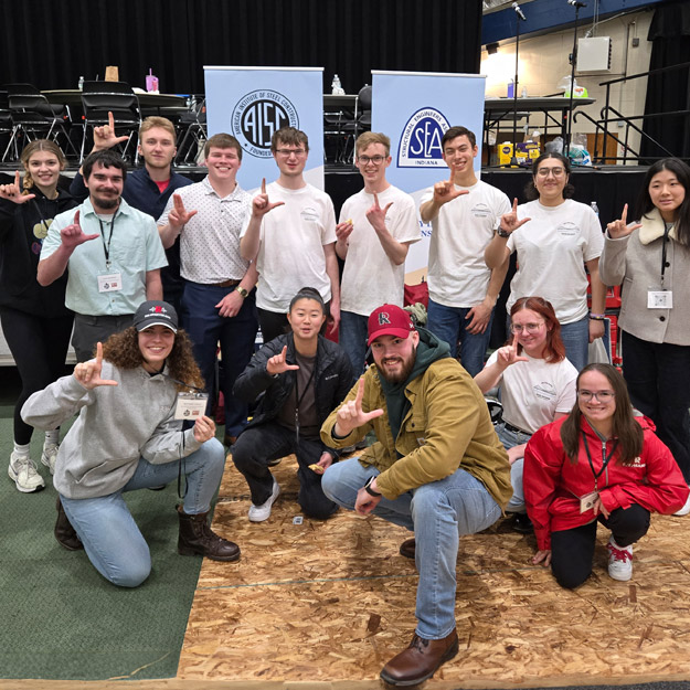 Rose-Hulman's Steel Bridge team on stage accepting their award, along with two smaller images of the team building its bridge.