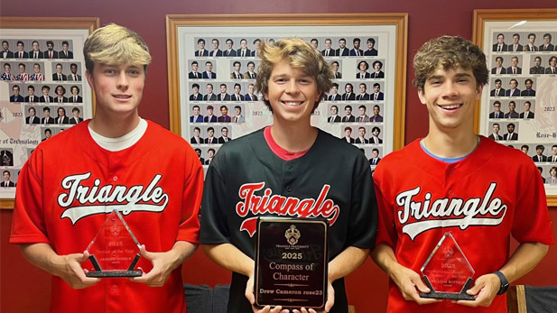 Jansen Biddle, William Wittich, and Andrew Cameron hold their awards while wearing Triangle shirts.