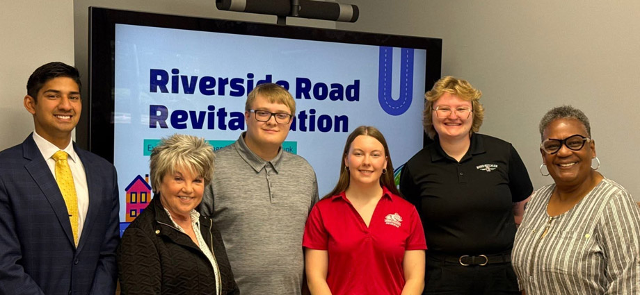 Three students stand with three leaders of Terre Haute. 
